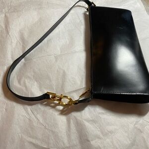 Salvatore Ferragamo Black Leather Clutch with Gold Accents